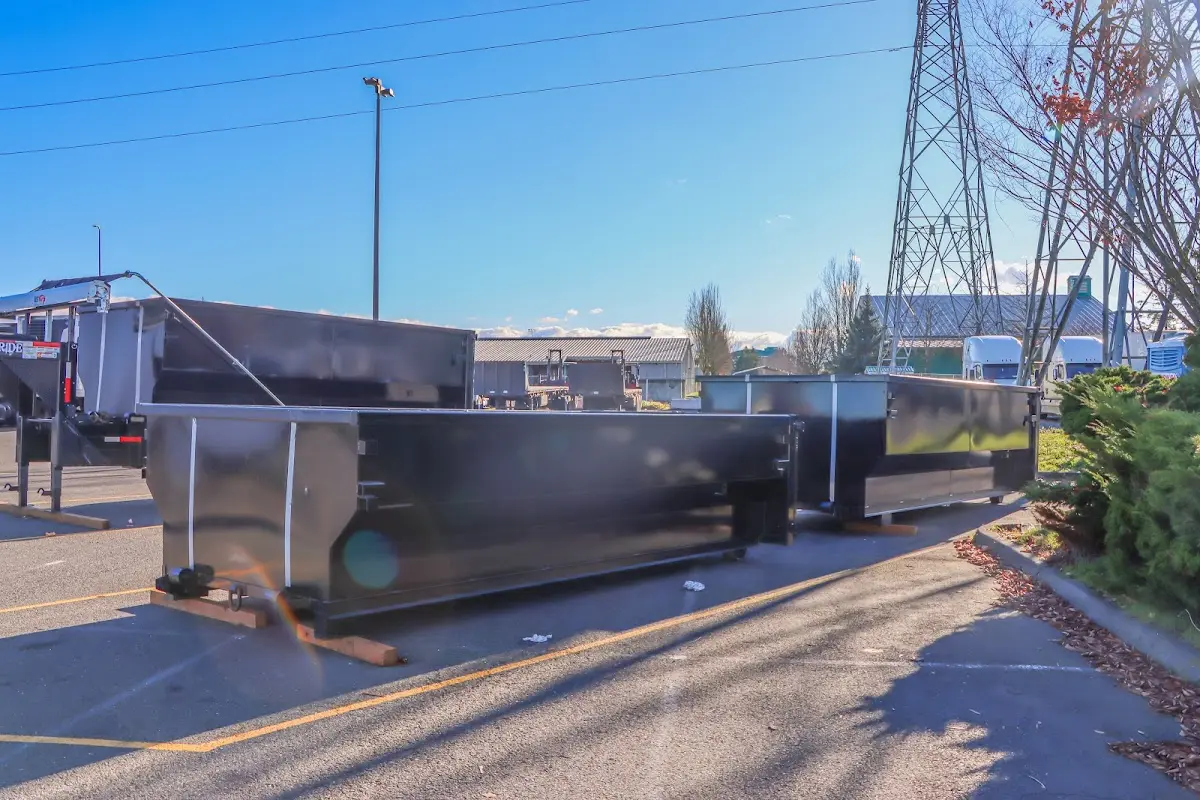 Roll-off dumpster ready for waste disposal at job site for 3 Yard Dumpster Rental in Half Moon